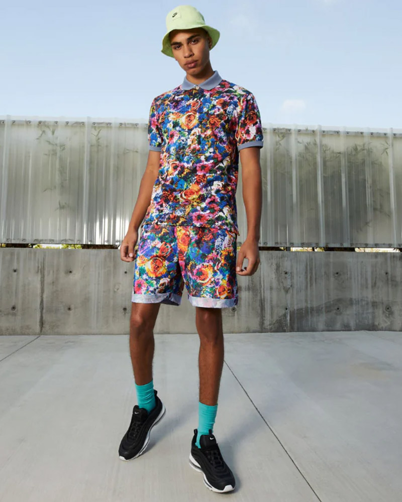 Young man in floral shirt and shorts